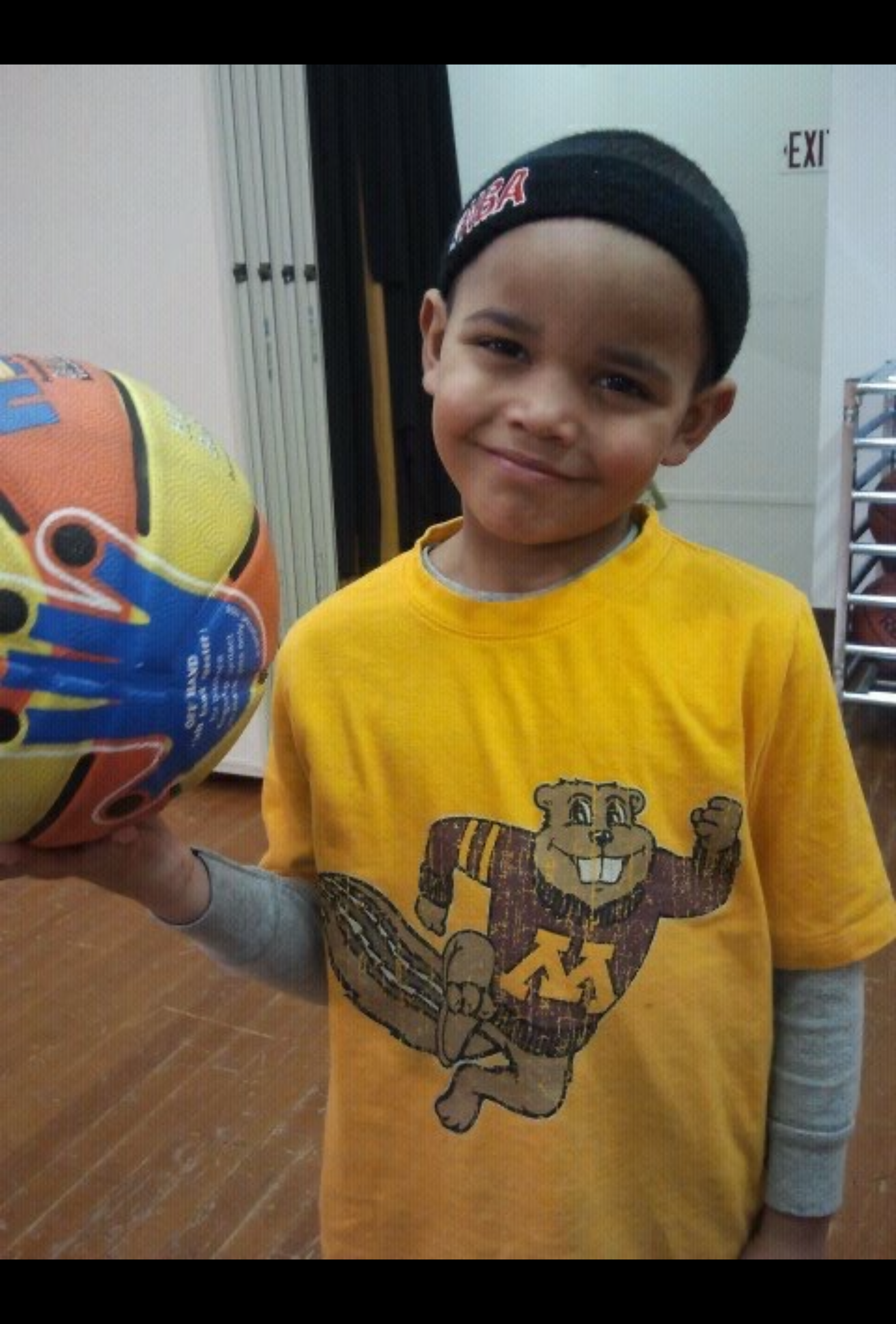 A young Tian Chatman holding a basketball