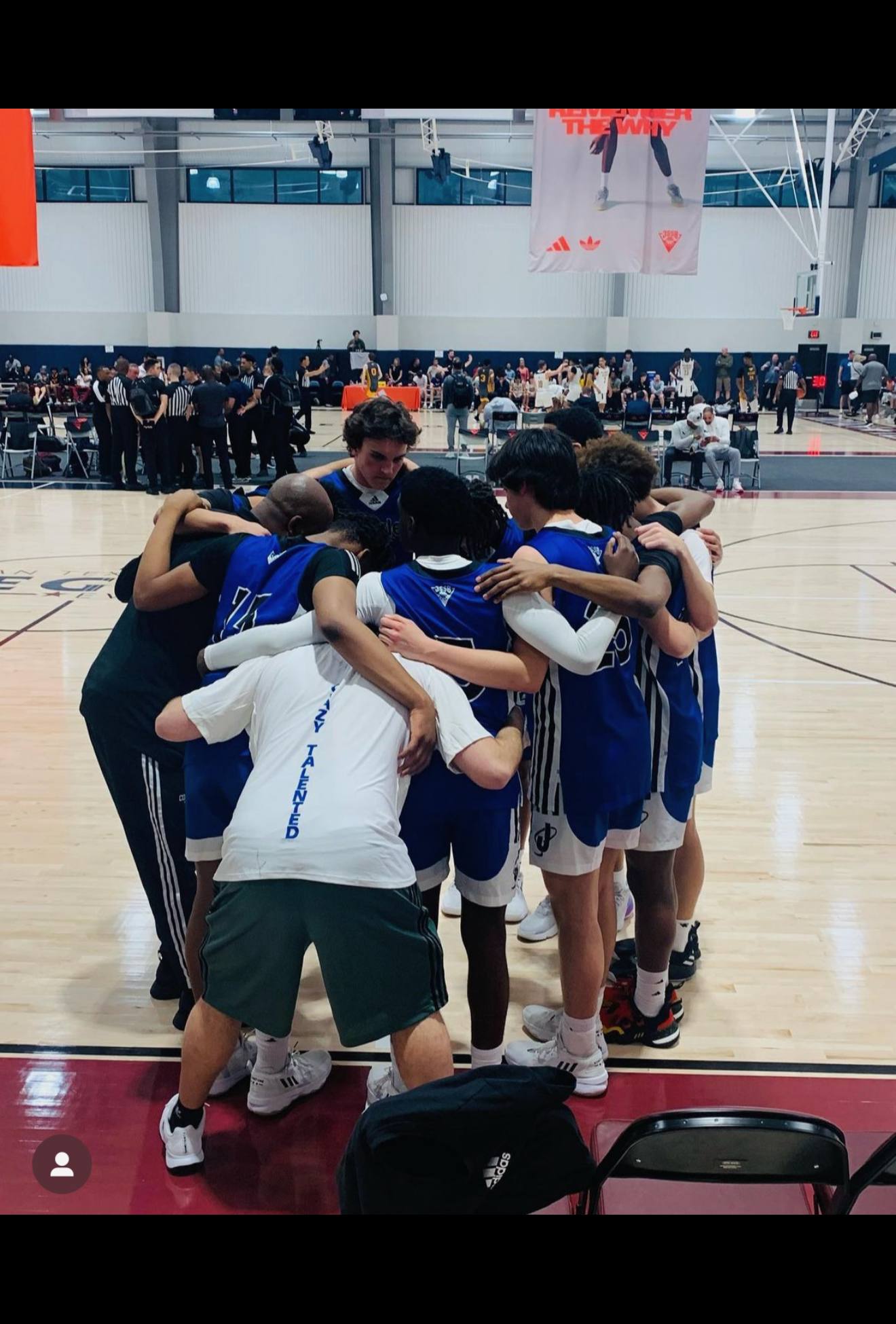 Tian's basketball team in a huddle